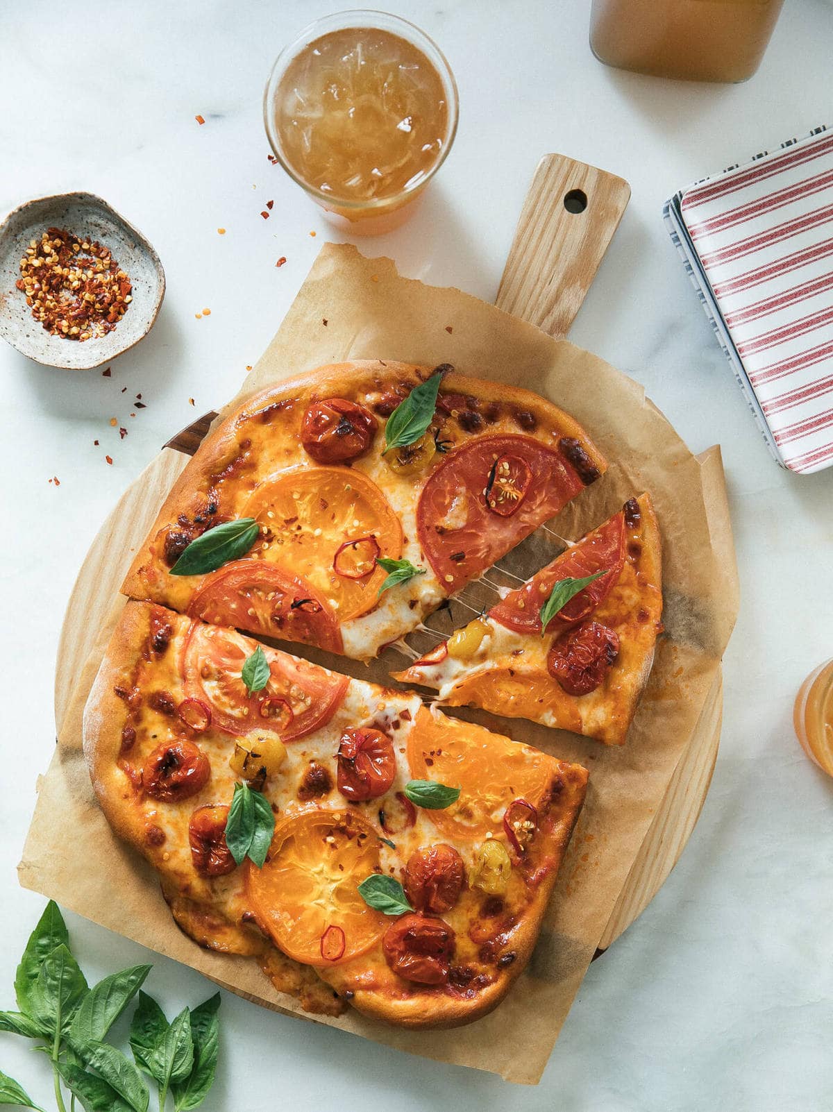 Heirloom Tomato Pizza with slices taken out. 