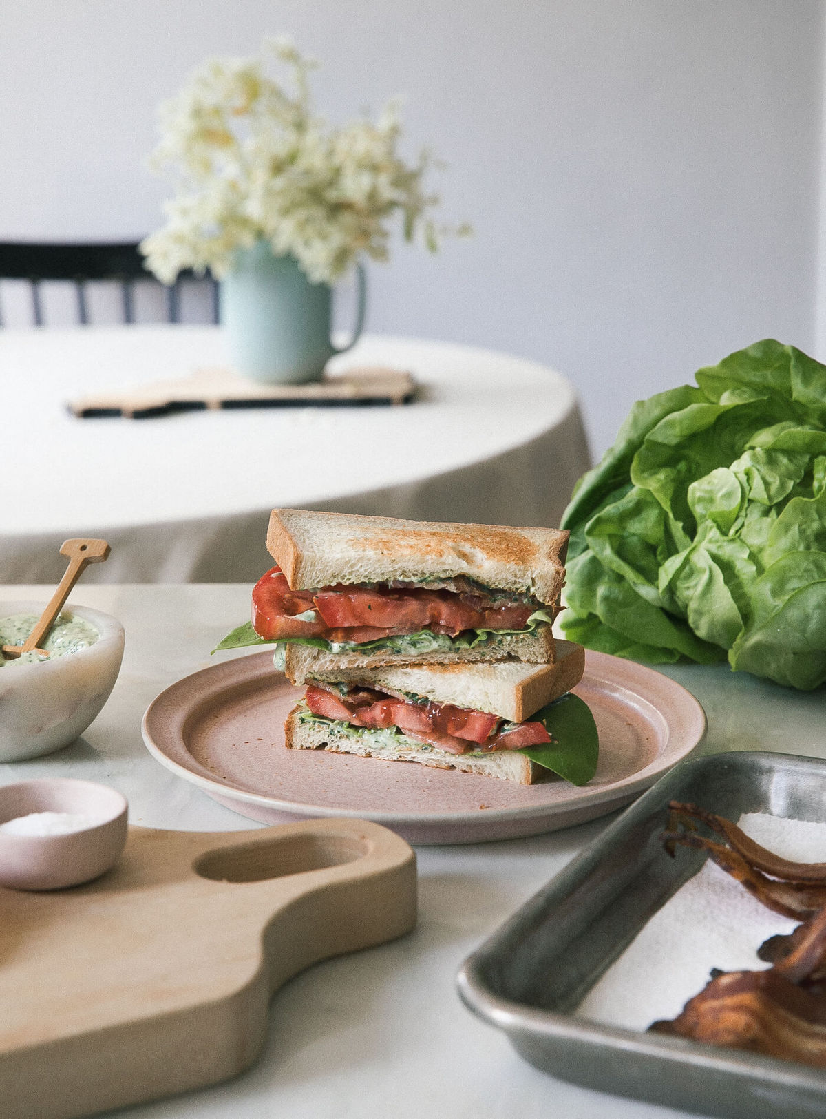 The best BLT Sandwich on a plate cut in half. 