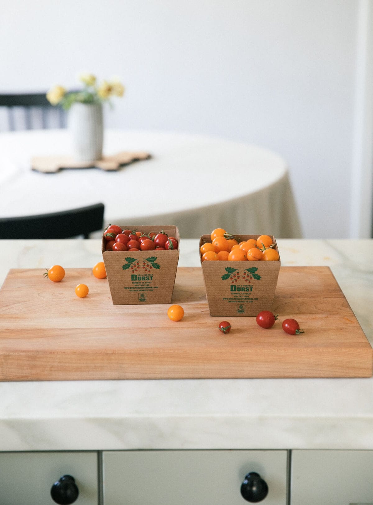 Tomatoes on cutting board. 