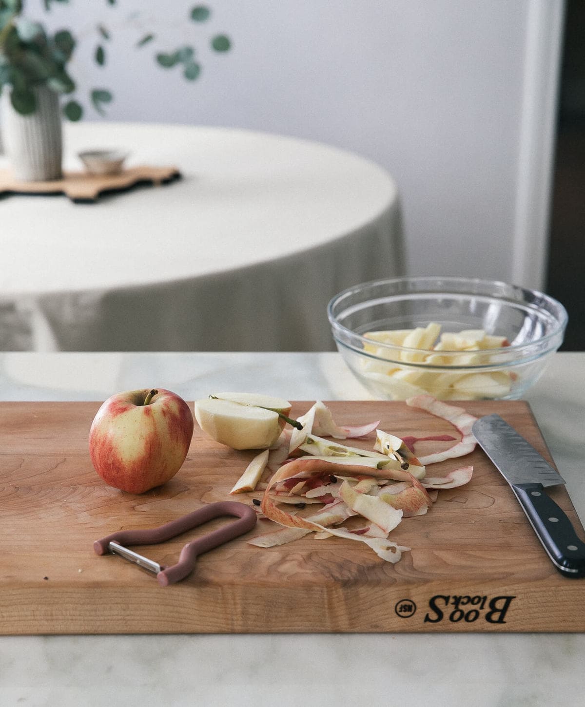 Apples being peeled. 