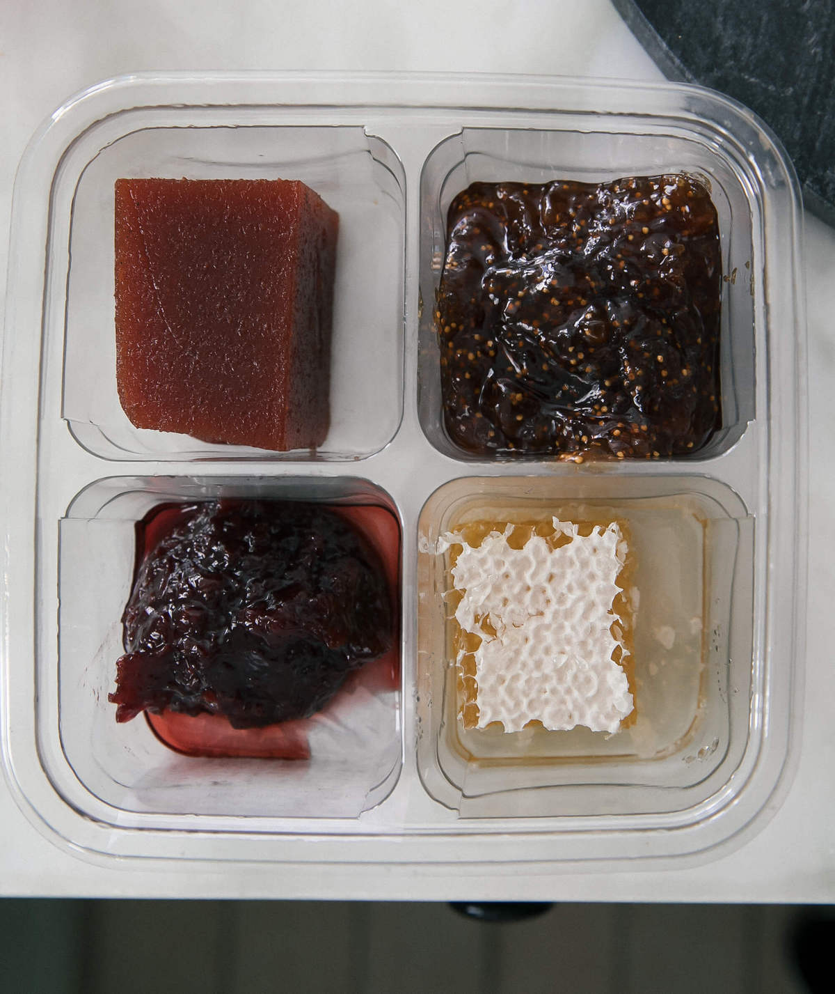 Honey and jam in a container. 