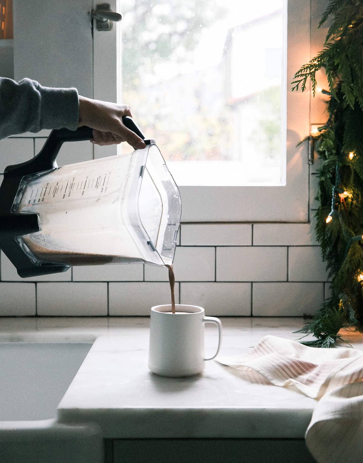 Oat Milk Hot Chocolate being poured into a mug. 