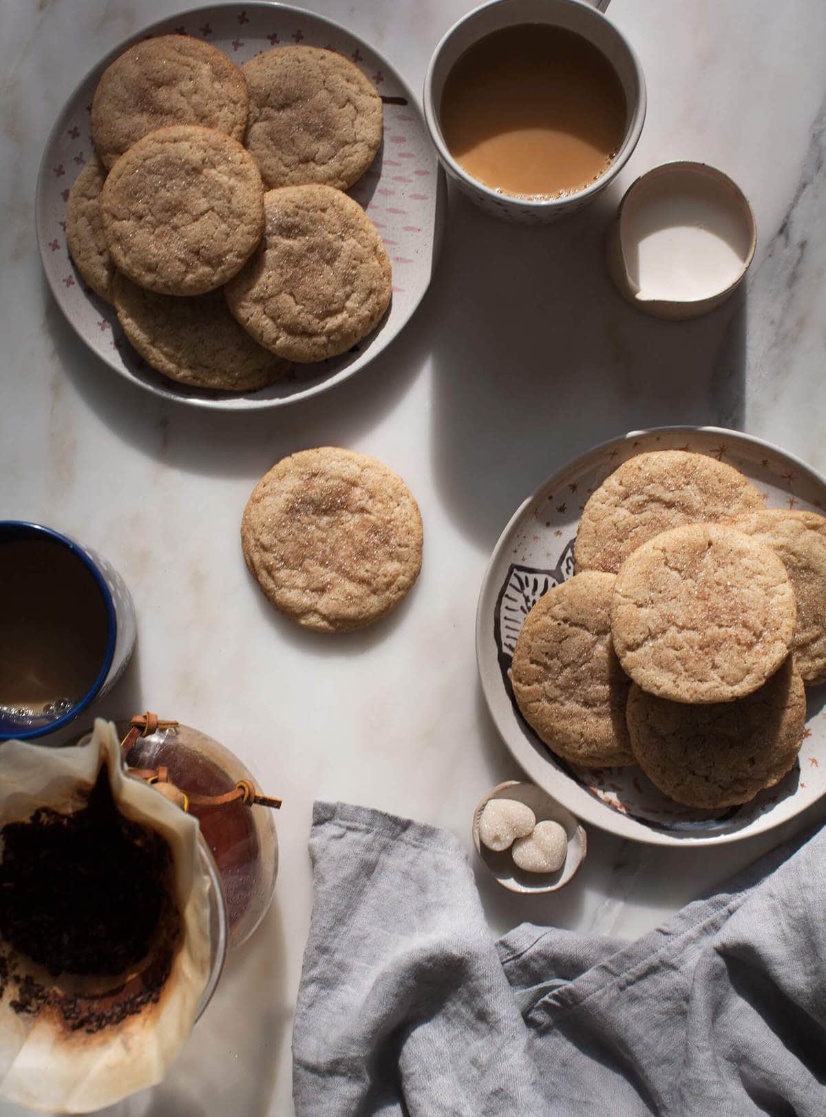 Chewy Chai Masala Snickerdoodles on a plate with chai. 