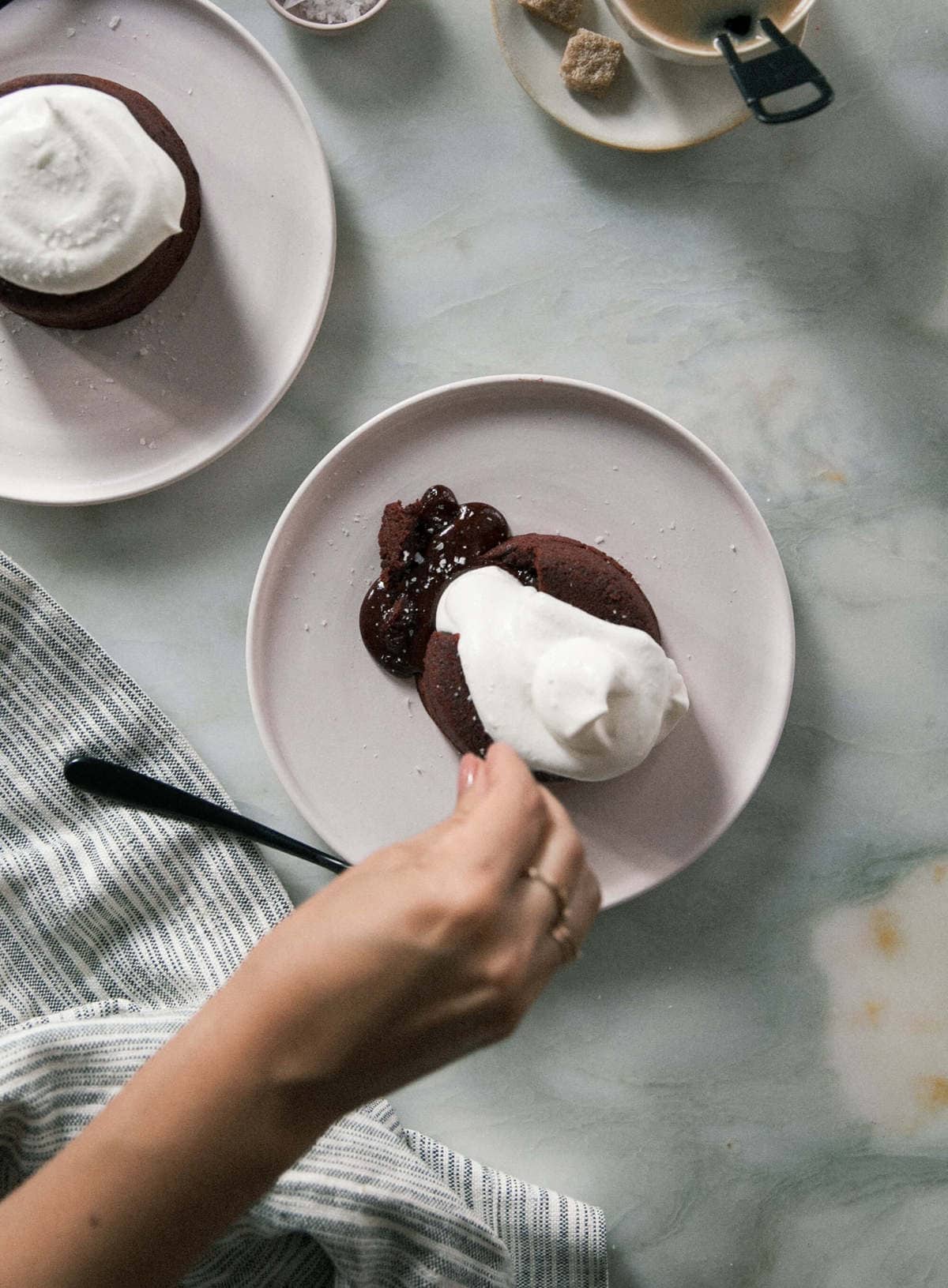 Red Velvet Lava Cakes with coffee and sugar on the side.