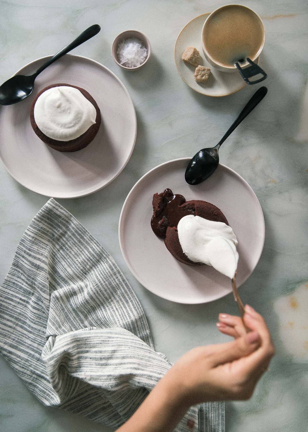Red Velvet Lava Cakes on plates with coffee.