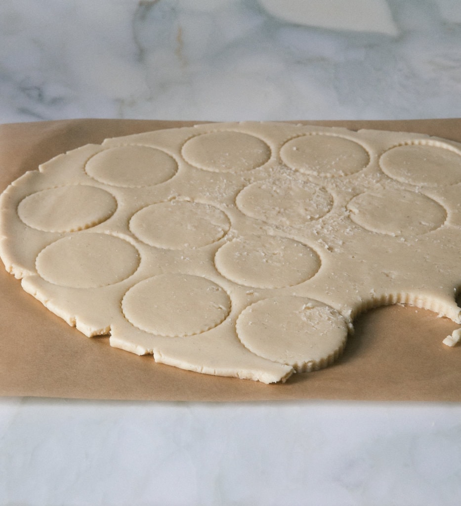 Alfajores dough being cut out. 