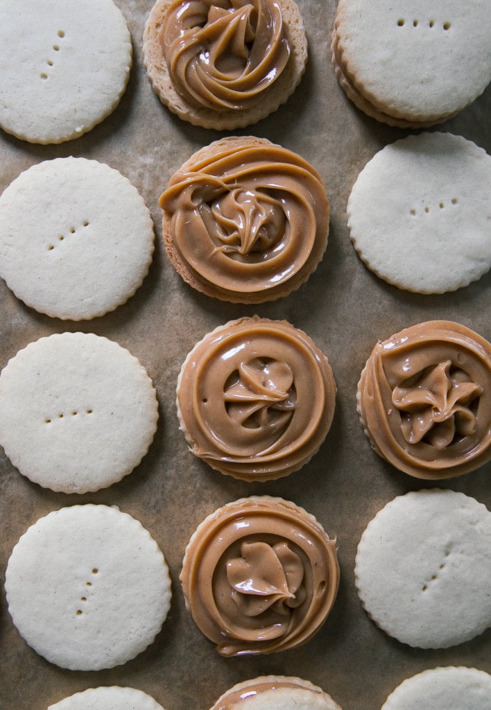 Alfajores about to be sandwiched together. 