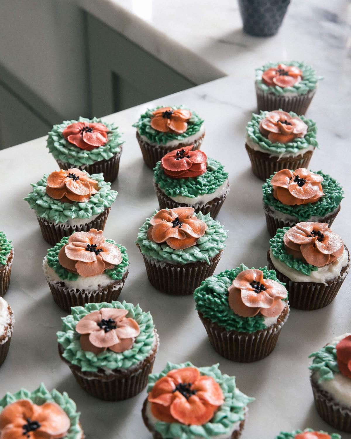 Carrot Cake Cupcakes on counter. 