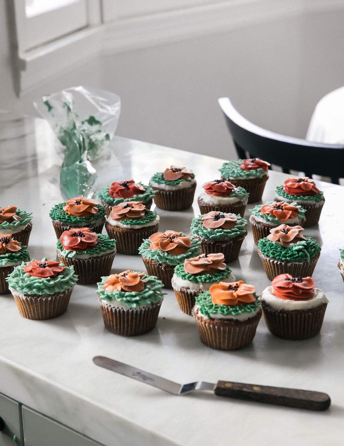 Carrot Cake Cupcakes on a counter. 