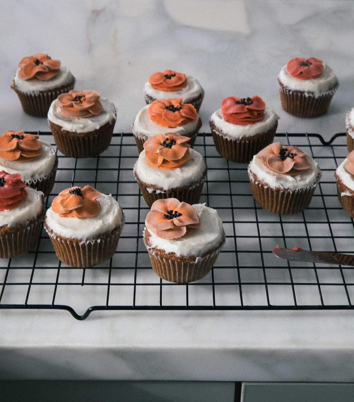 Carrot Cake Cupcakes on a counter. 