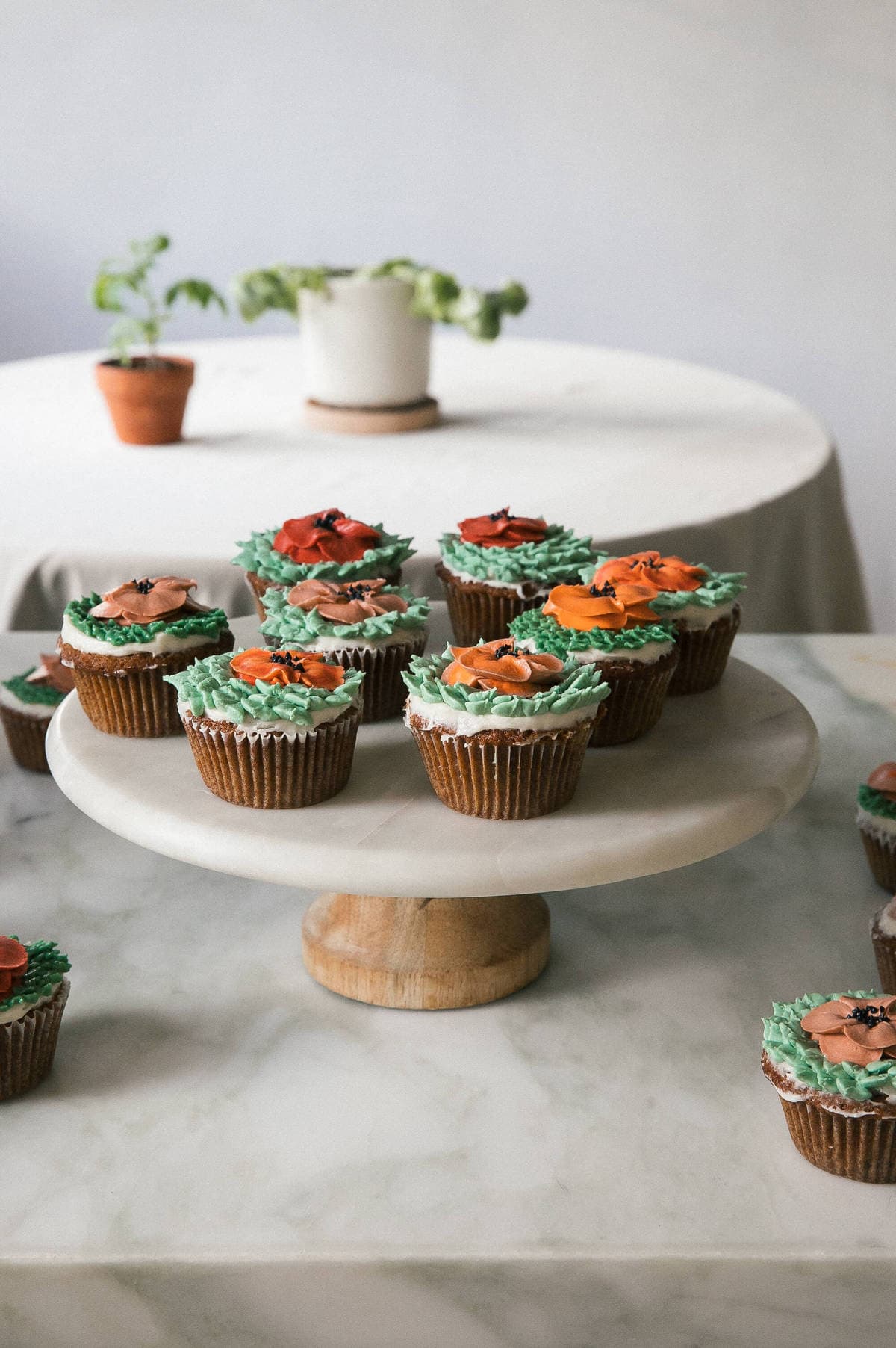 Carrot Cake Cupcakes on cake stand. 