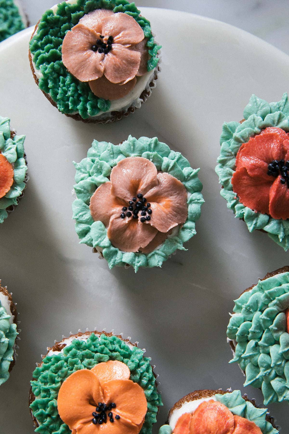 Carrot Cake Cupcakes on a counter. 