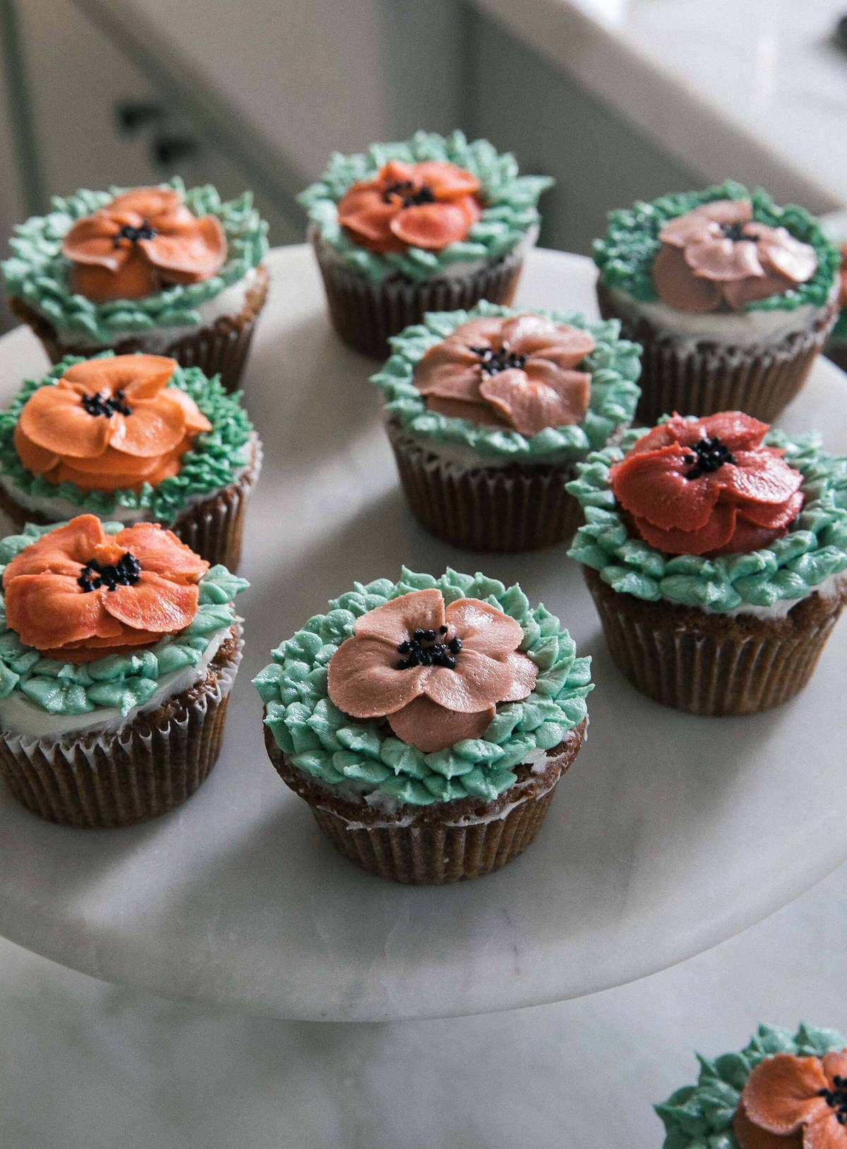 Carrot Cake Cupcakes on a counter.