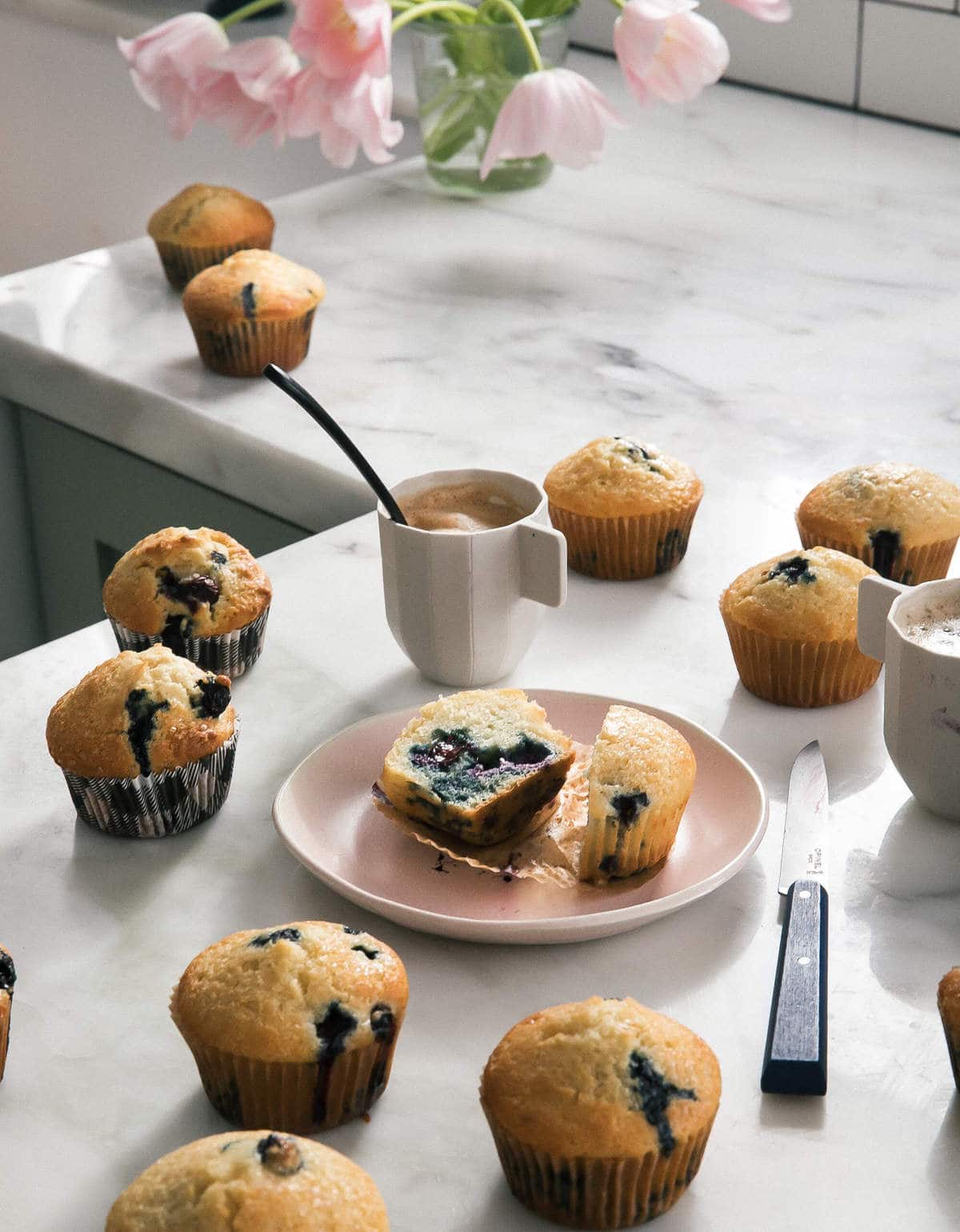 Best Blueberry Muffin halved with coffee. 