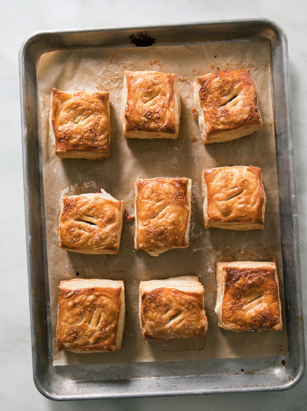 Pastelitos de Guayaba con Queso on a baking sheet. 