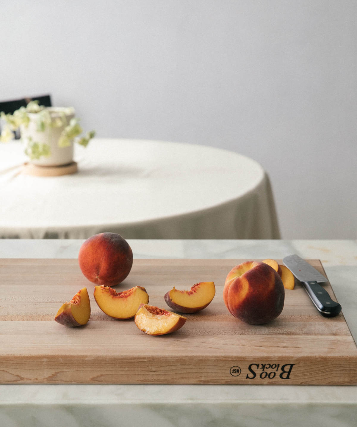 Peaches on a cutting board. 
