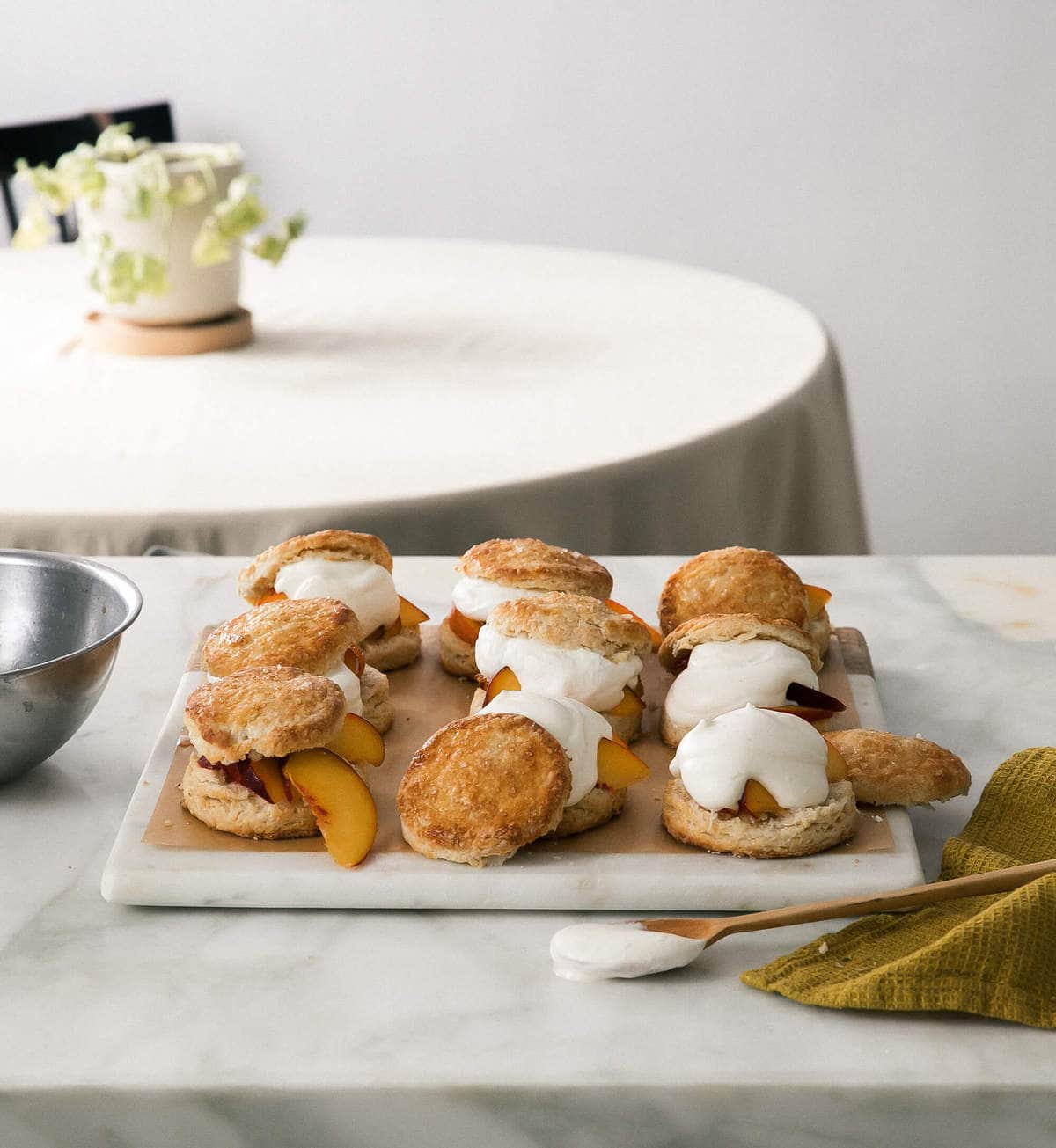 Peach Shortcakes assembled with peaches and whipped cream. 