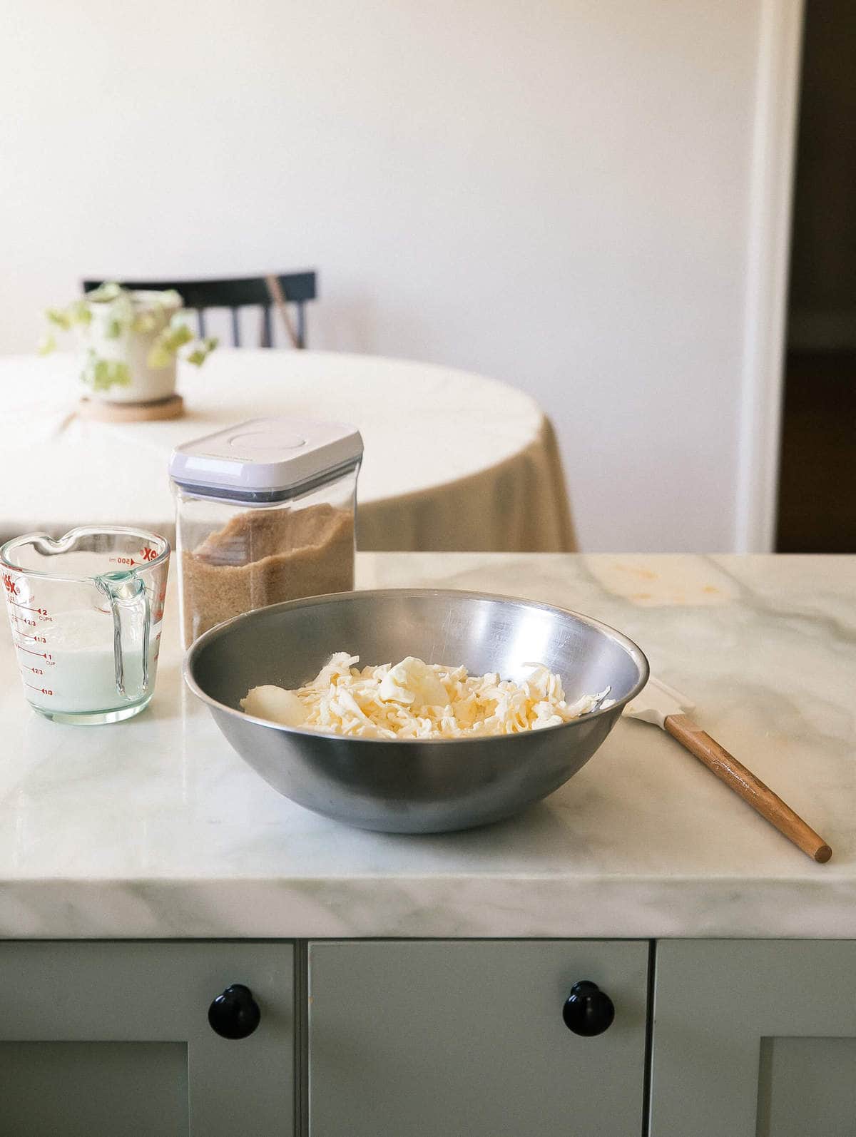 Butter being mixed into flour. 