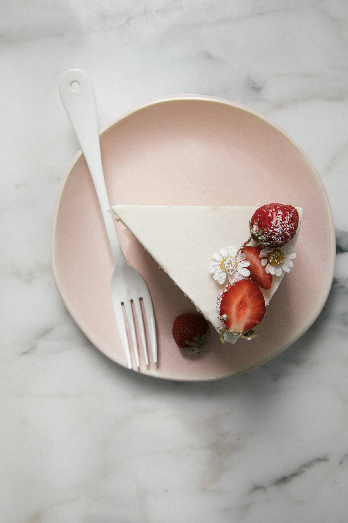 Slice of Strawberry Cream Cake on plate. 