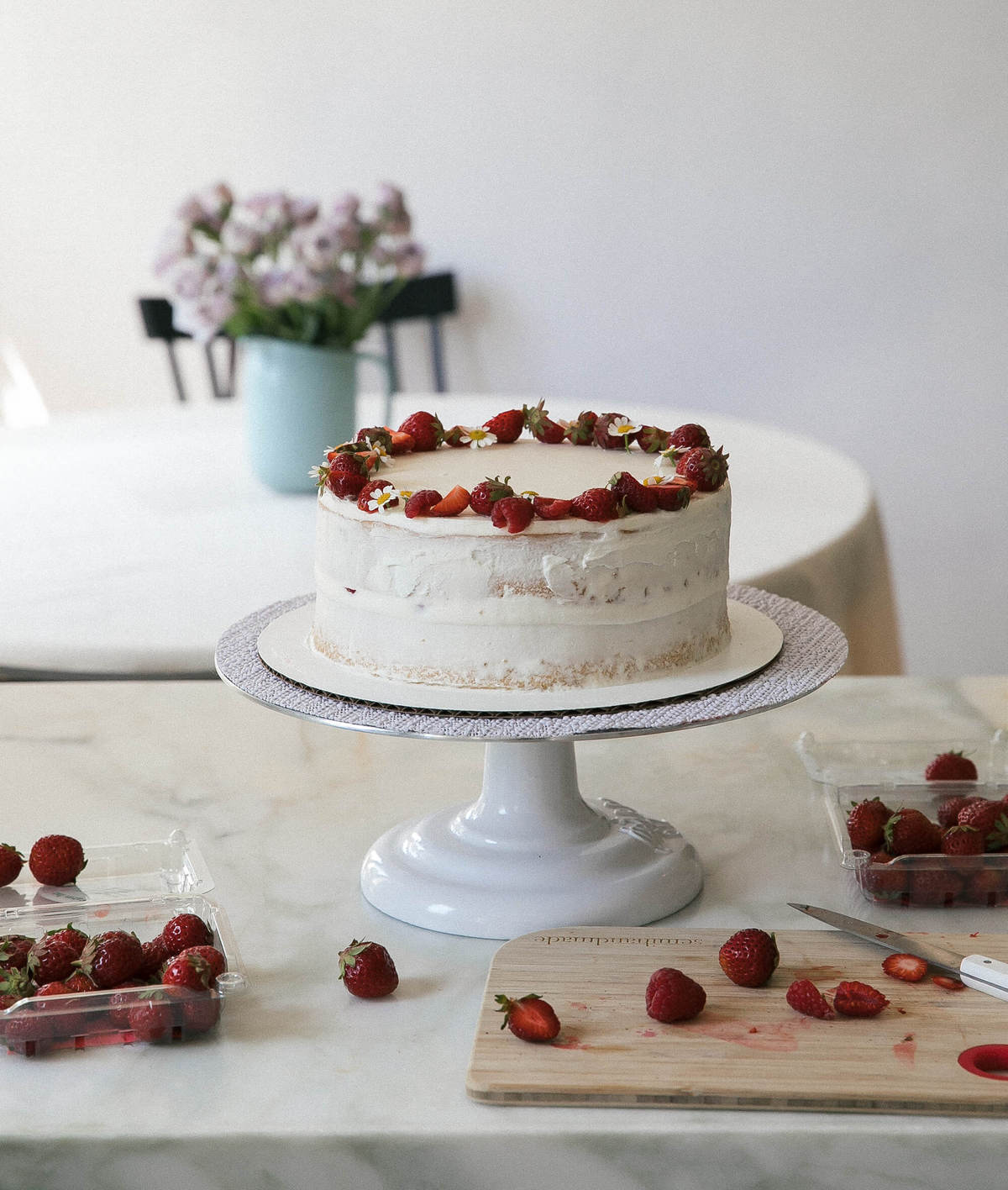 Strawberry Cream Cake decorated on cake stand. 