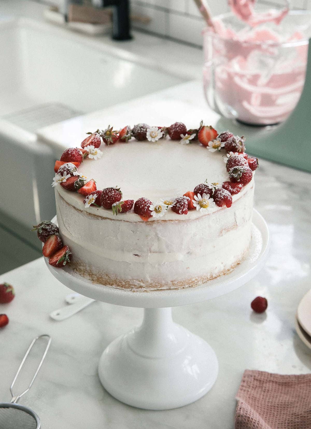 Strawberry Cream Cake decorated on cake stand. 