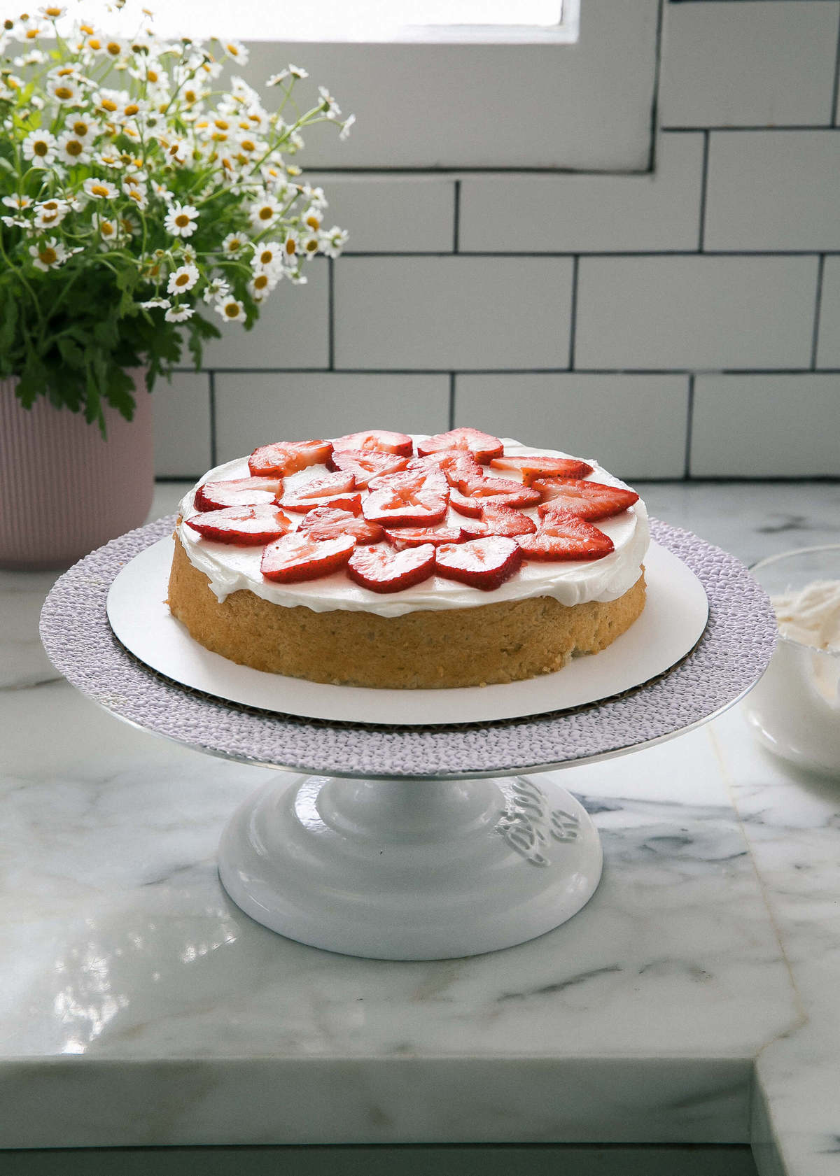 Strawberries added to cake. 