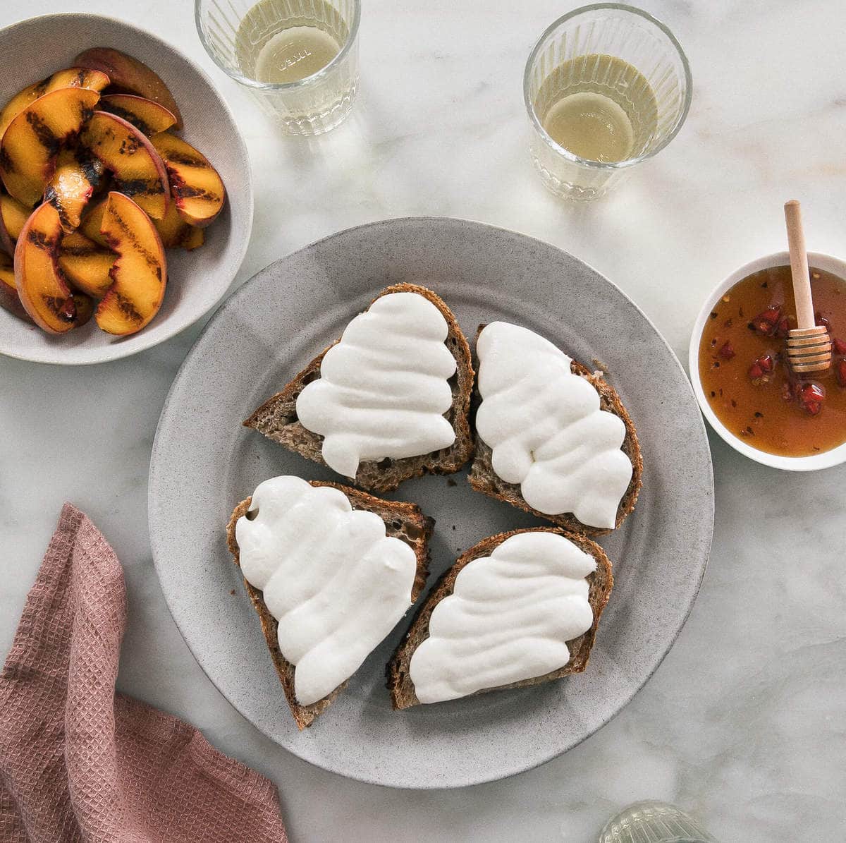 Whipped Goat Cheese with Grilled Peaches on a plate. 