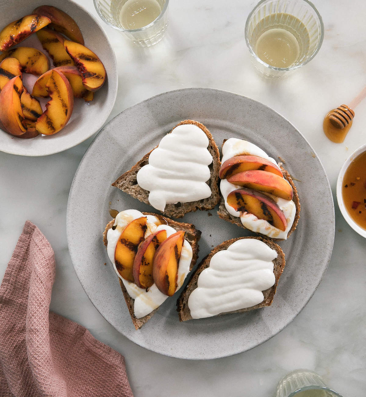 Whipped Goat Cheese with Grilled Peaches on a plate. 