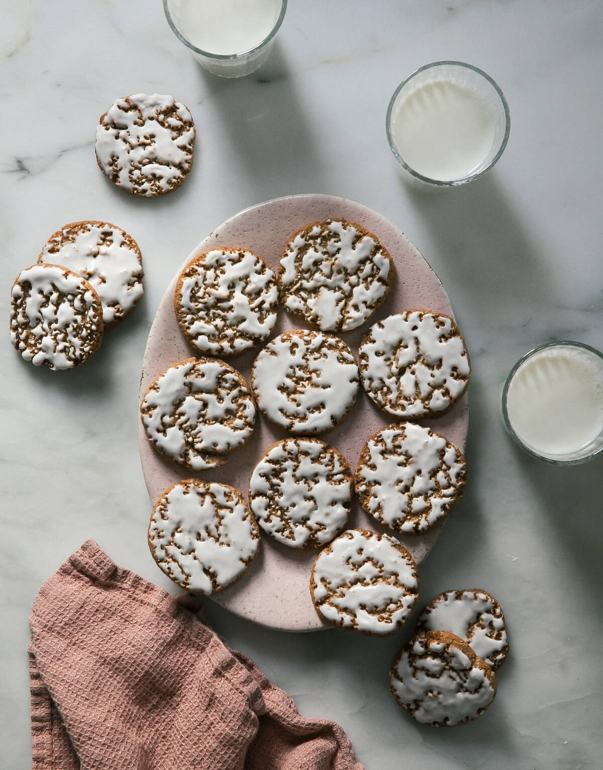 Iced Oatmeal Cookies on a plate.