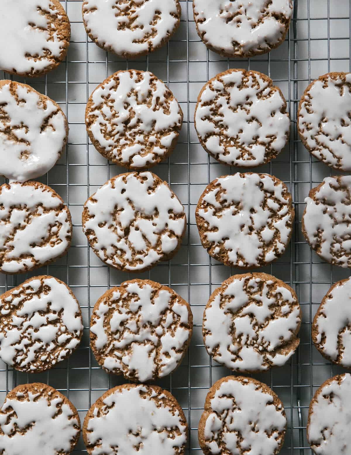 Iced Oatmeal Cookies on a baking rack. 