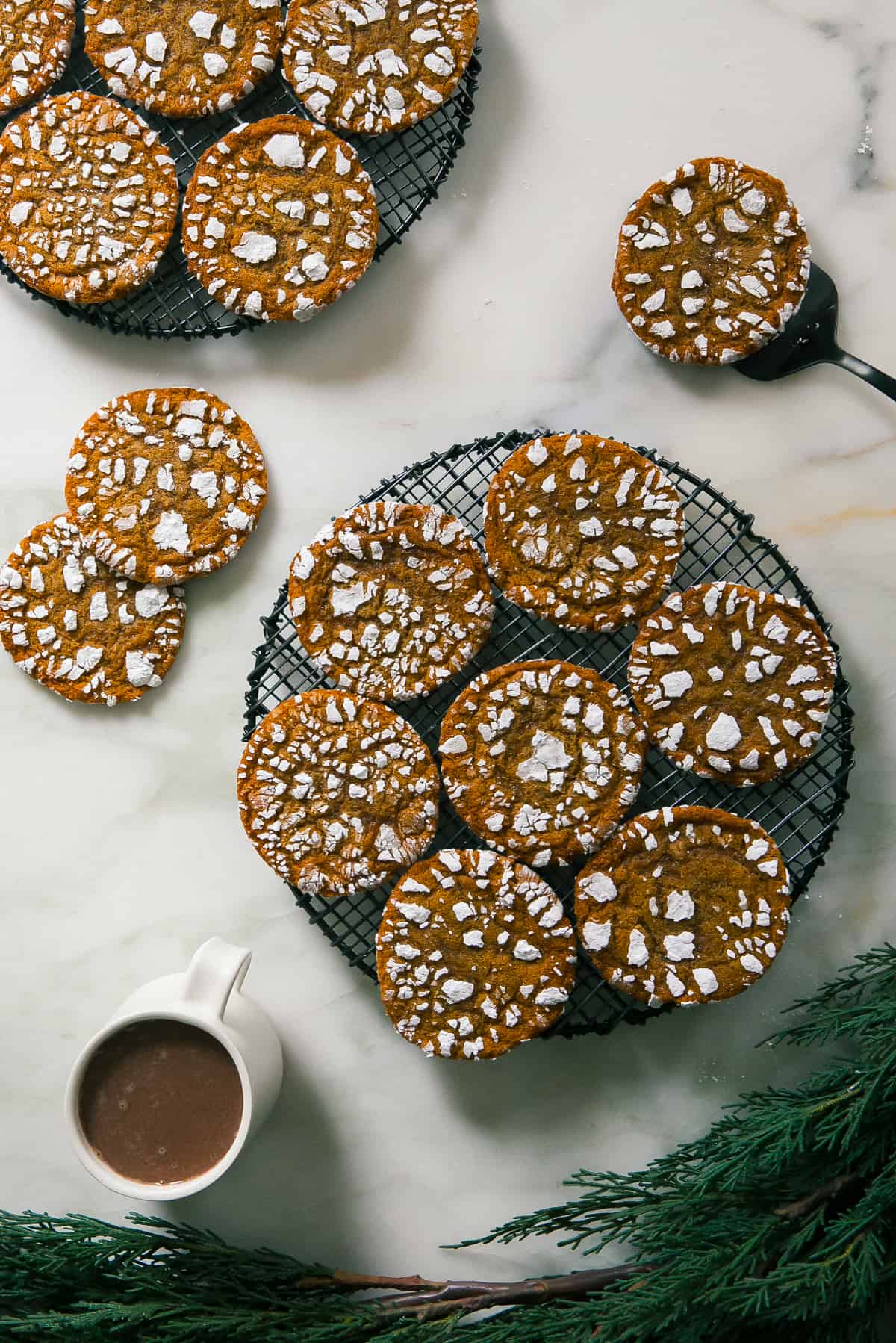 Gingerbread Crinkle Cookies on a baking rack. 