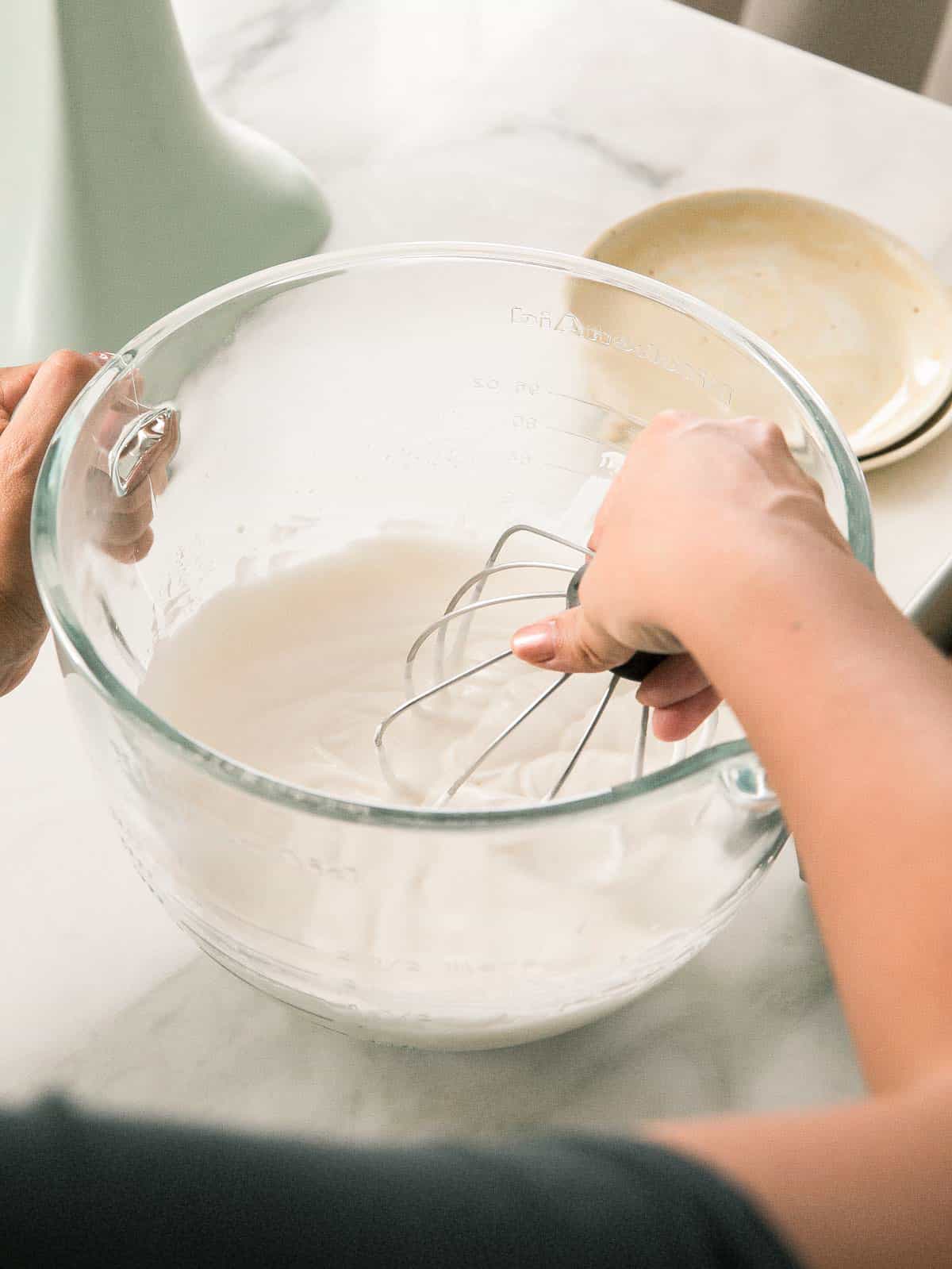 Whipped cream in bowl. 