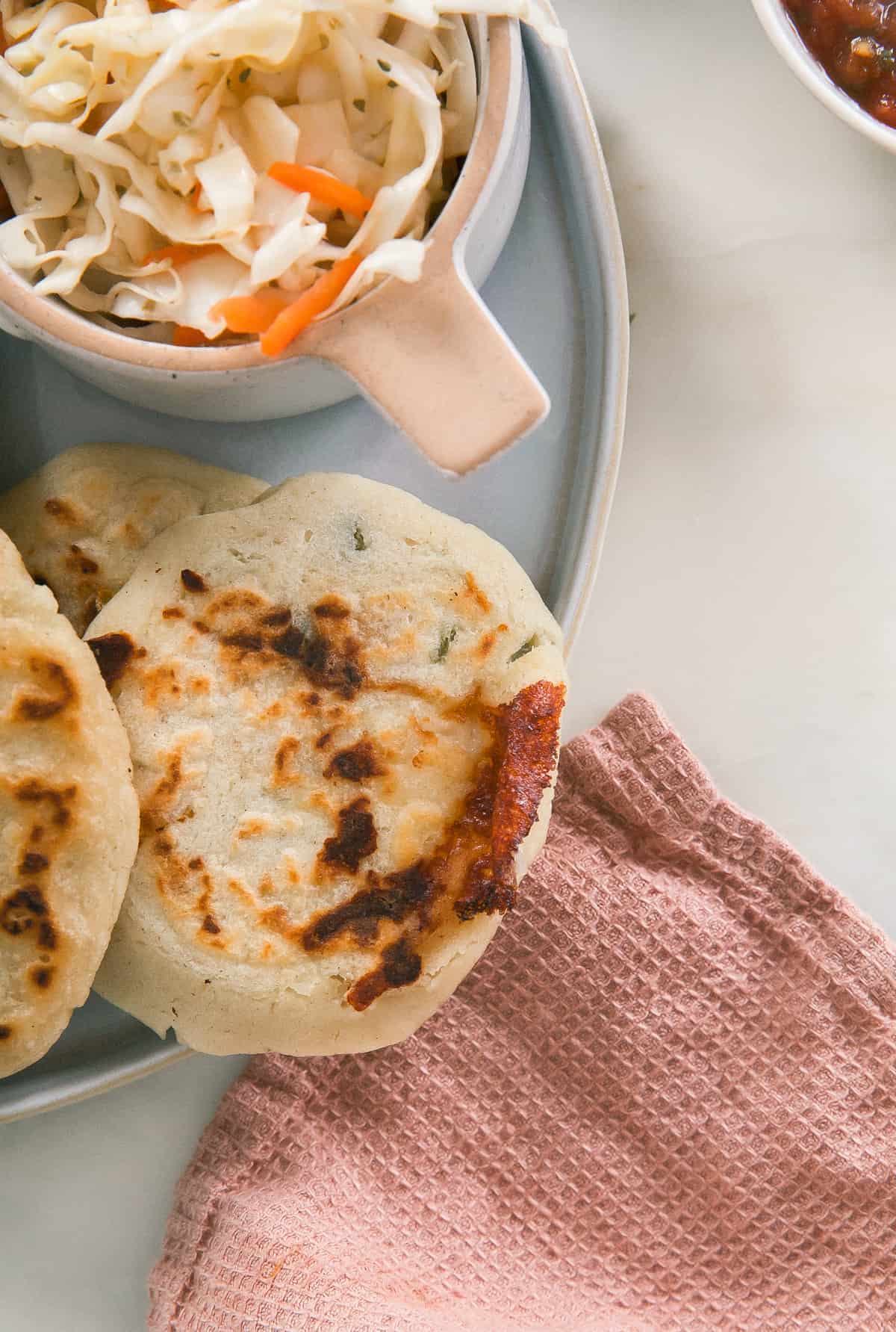 Close up of a cheesy pupusa