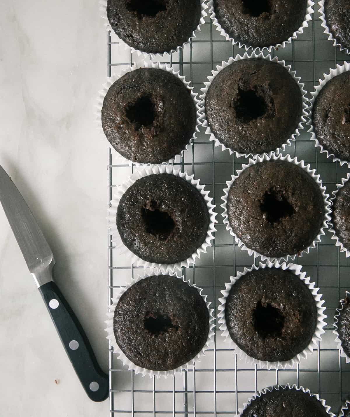 Cupcakes having a hole cut out. 