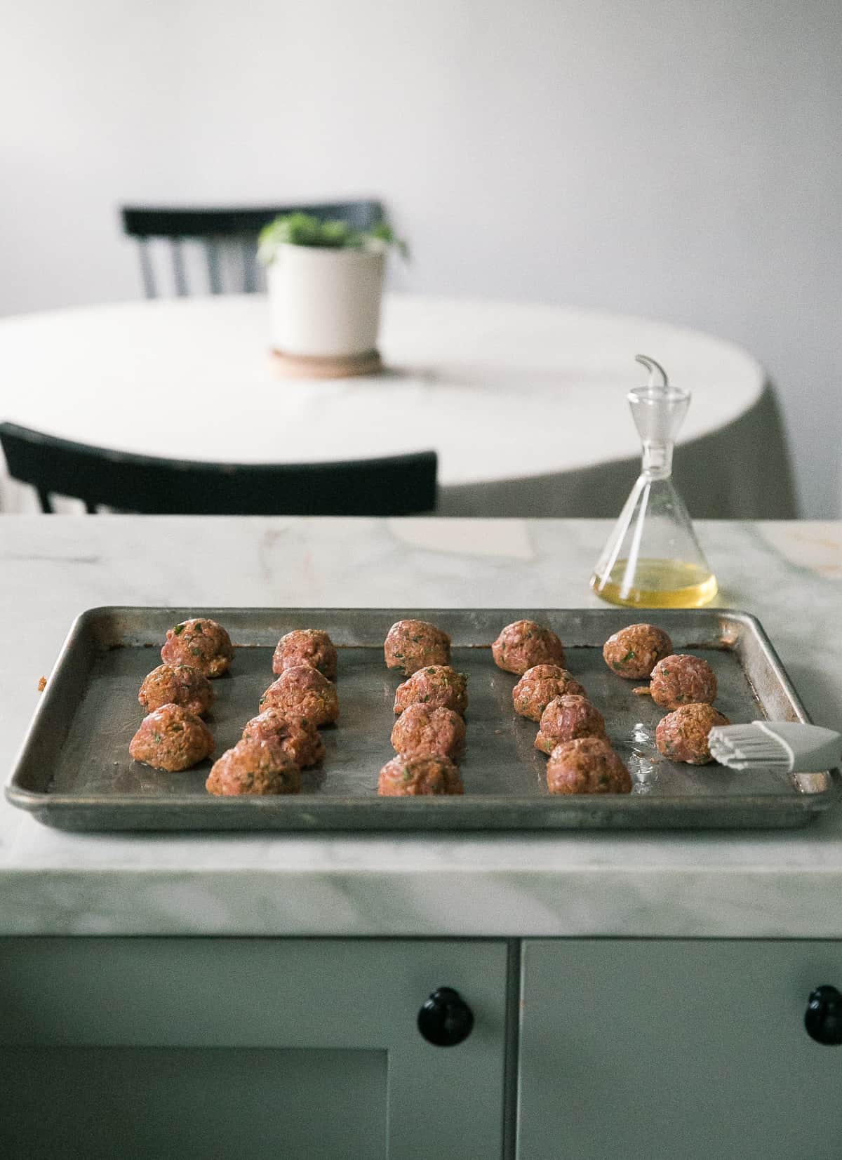 Meatballs on a baking sheet.