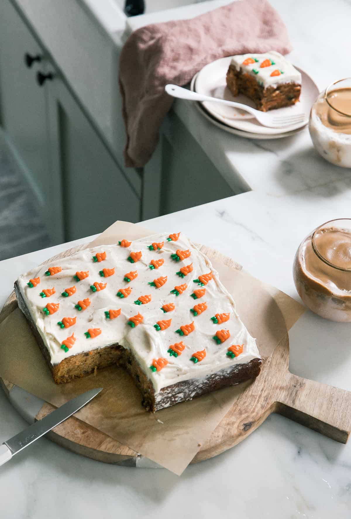 Mini Carrot Cake with Brown Butter Cream Cheese Frosting on a cutting board.