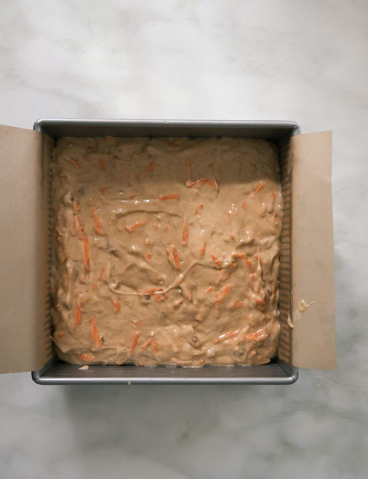 Carrot cake batter in baking pan