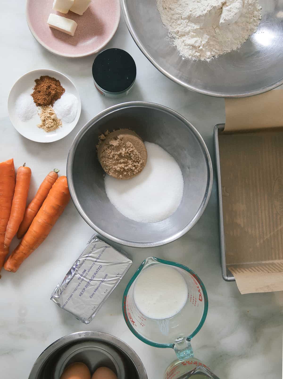Ingredient shot of flour, spices, sugars, carrots