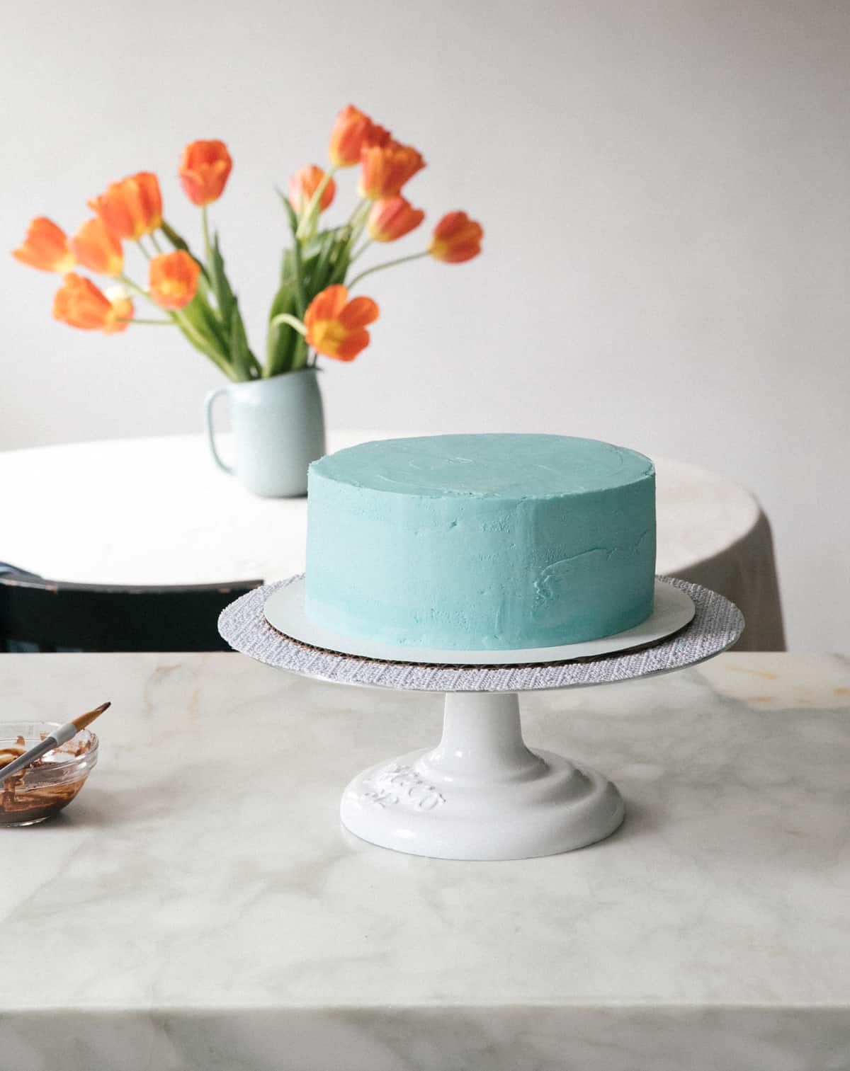 Speckled Egg Cake on counter being decorated.