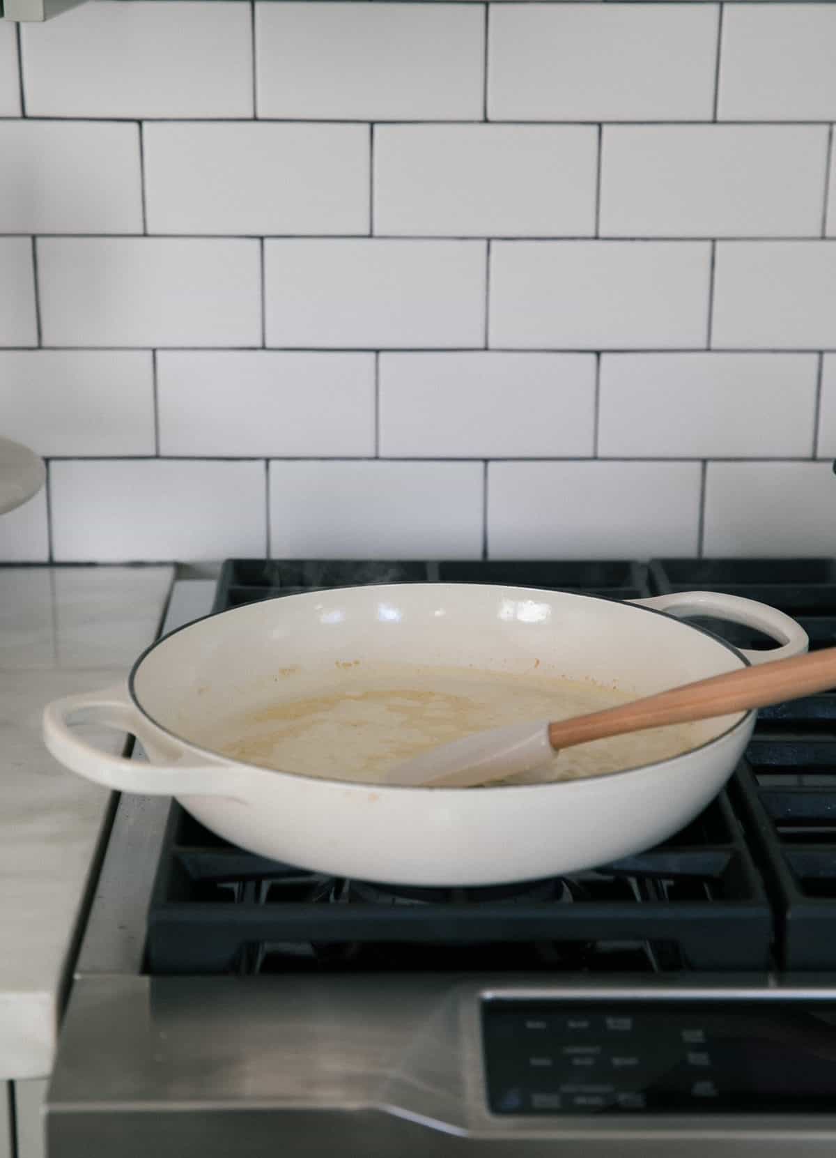 Sauce cooking in pan. 