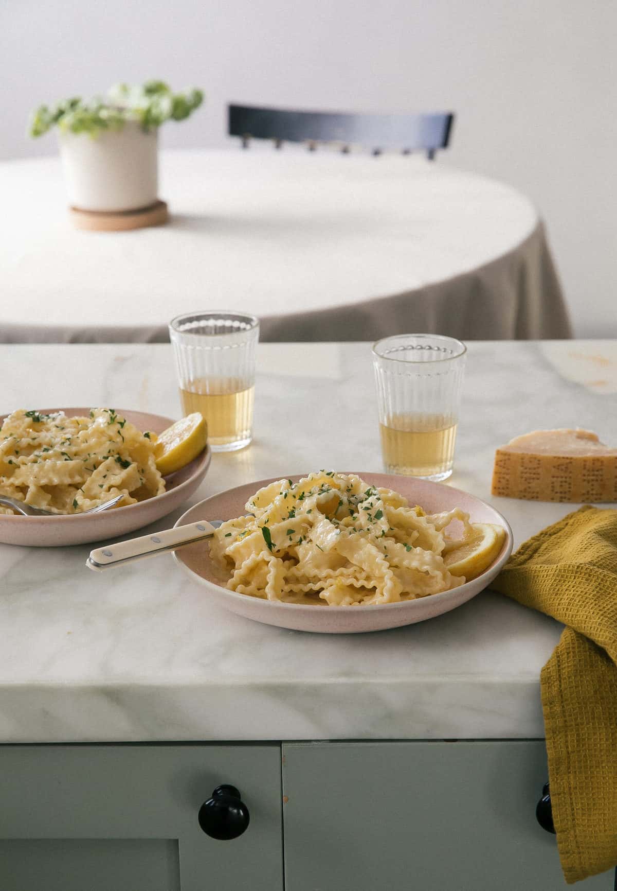 Pasta al Limone in bowls with wine. 