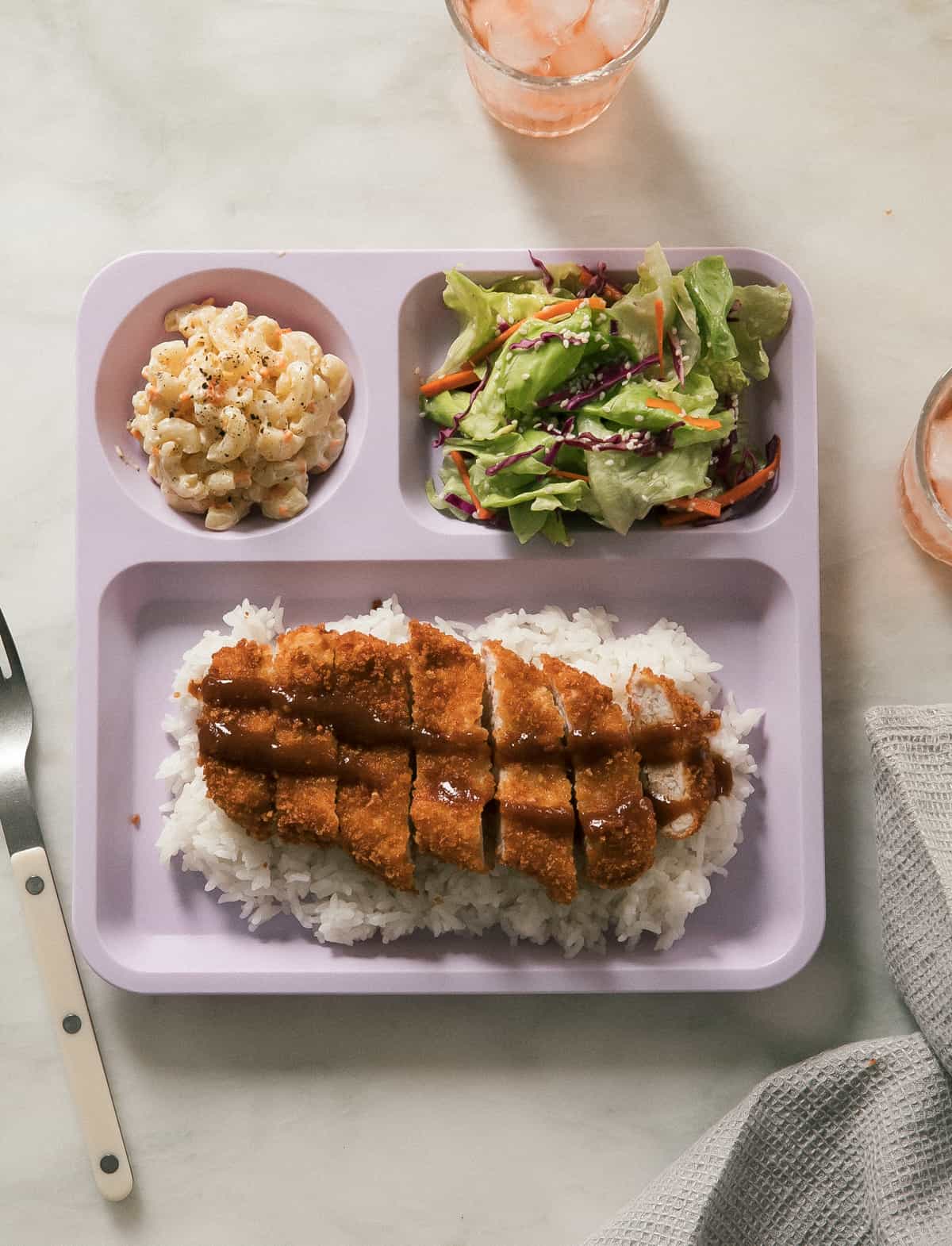 Overhead pork katsu on plate with mac salad and salad