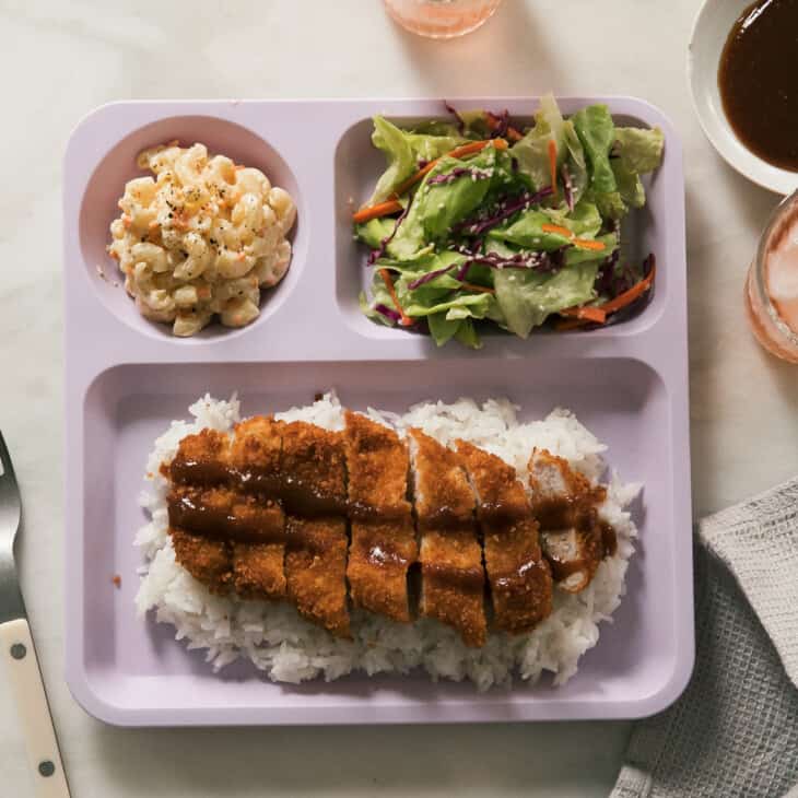 Overhead pork katsu on plate with mac salad and salad