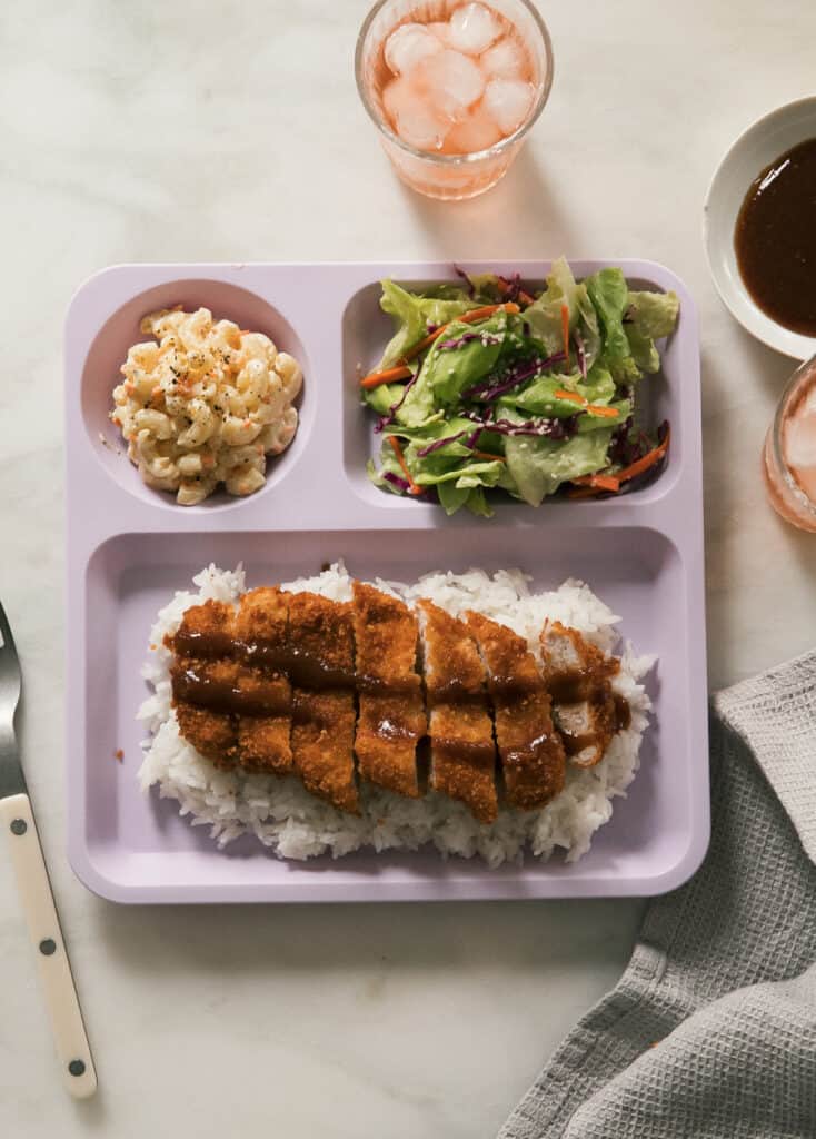 Overhead pork katsu on plate with mac salad and salad