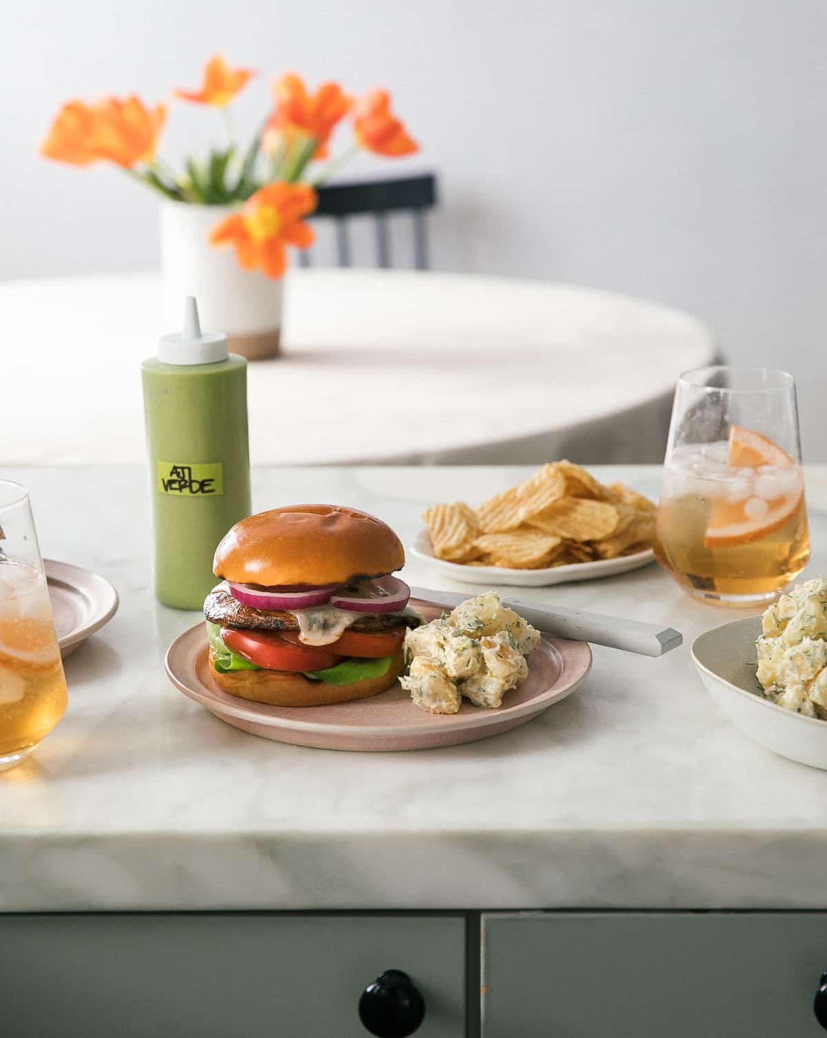 Grilled Portobello Mushroom Burgers on plate with potato salad.