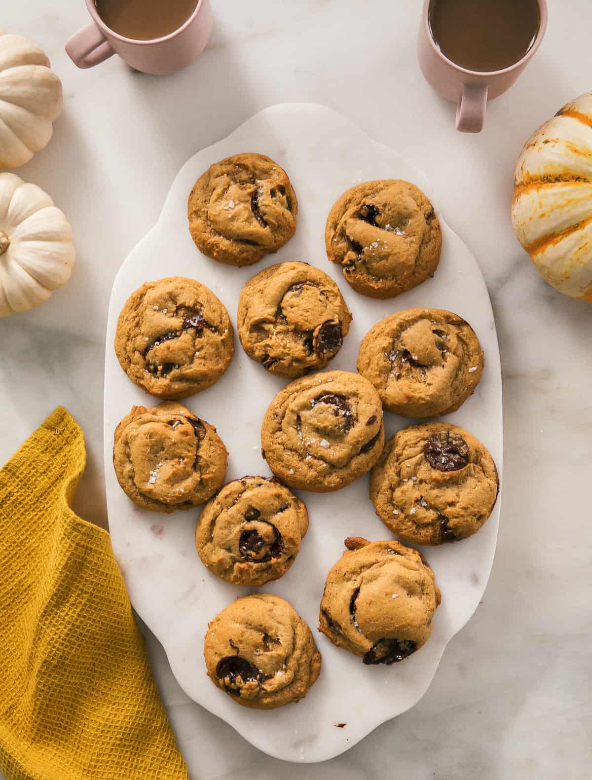 Pumpkin Chocolate Chip Cookies on a cuttingboard.