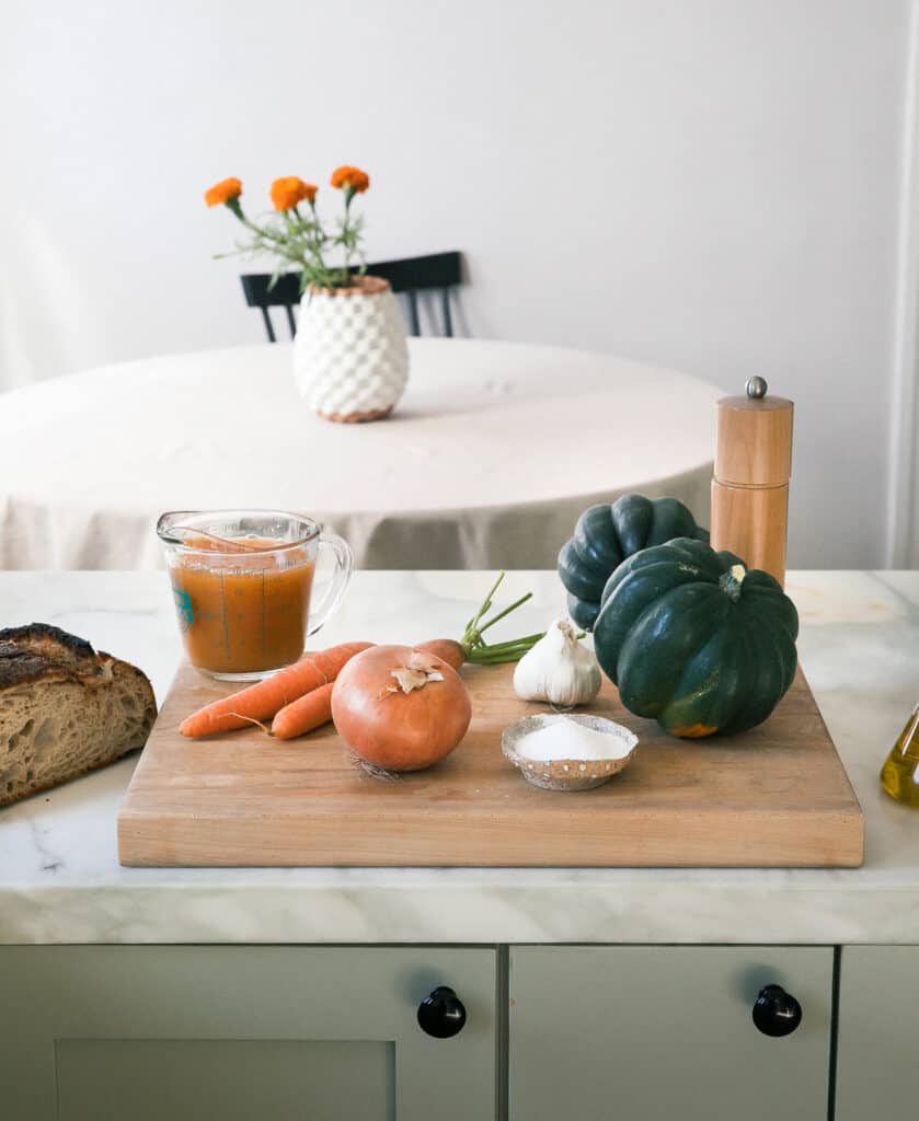 Ingredients for the acorn squash on a cutting board. 