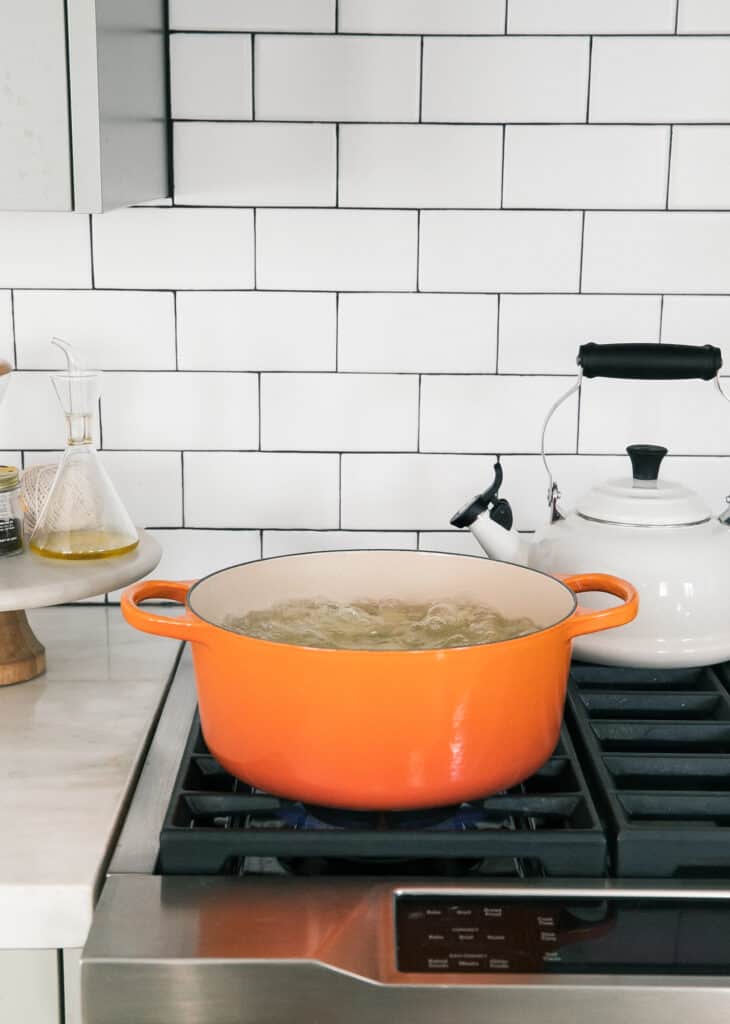 Potatoes boiling in a pot.