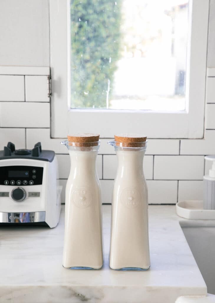 Pitchers of coquito about to chill in the fridge.