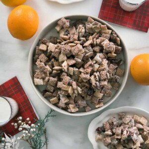 Panettone Chex Mix on counter with glasses of milk